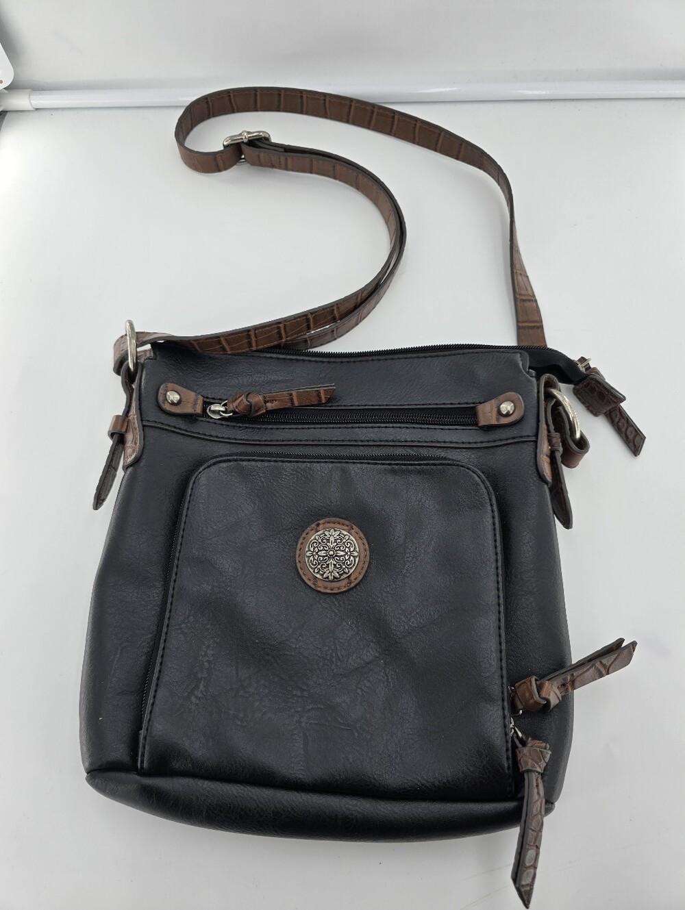 Bueno Black and Brown Crossbody Bag with Decorative Medallion